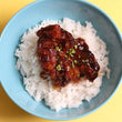 Soy Garlic chicken thigh fillet on top of steamed rice.