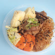 Braised beef and glass noodles, topped with agedashi tofu, poached cabbage, carrots, and mushrooms.